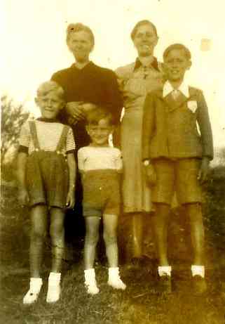 Babich family in Brdo: my great grandmother and grandmother in the back; my dad, Bruno, in the middle; his oldest brother, Ray, in the suit and brother, Ettore, to his right. Circa 1940.