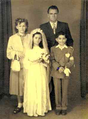 My mom -- Louisa Yurman at the time -- at her confirmation. Her cousin Lino is with her and she's joined by her Uncle Frank Carlovich and Aunt Yolanda Yurman. Circa 1953.