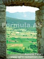 View of the Učka Mountain from the window of an abandoned home in the small village of Brdo